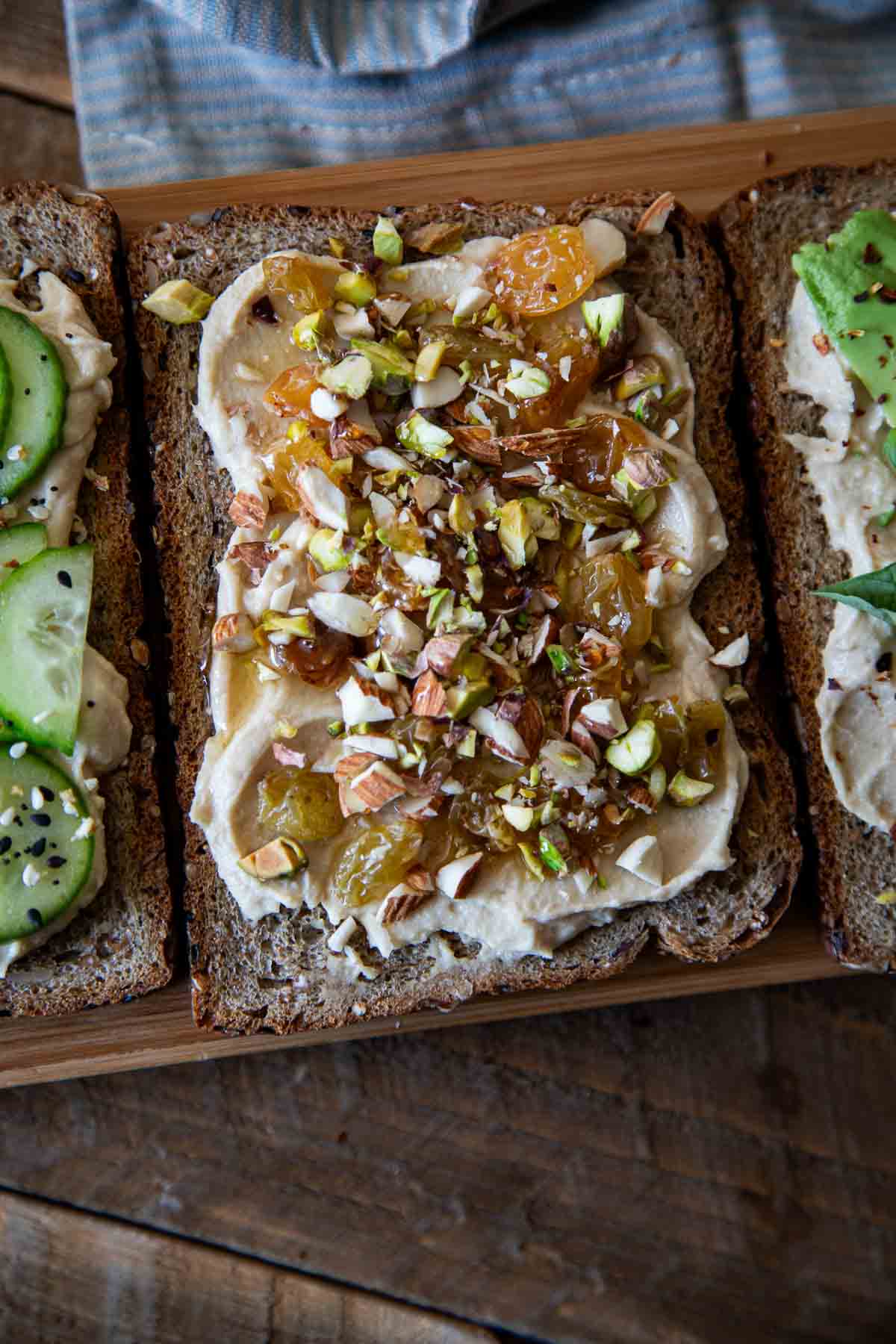 Hummus Toast with nuts and raisins