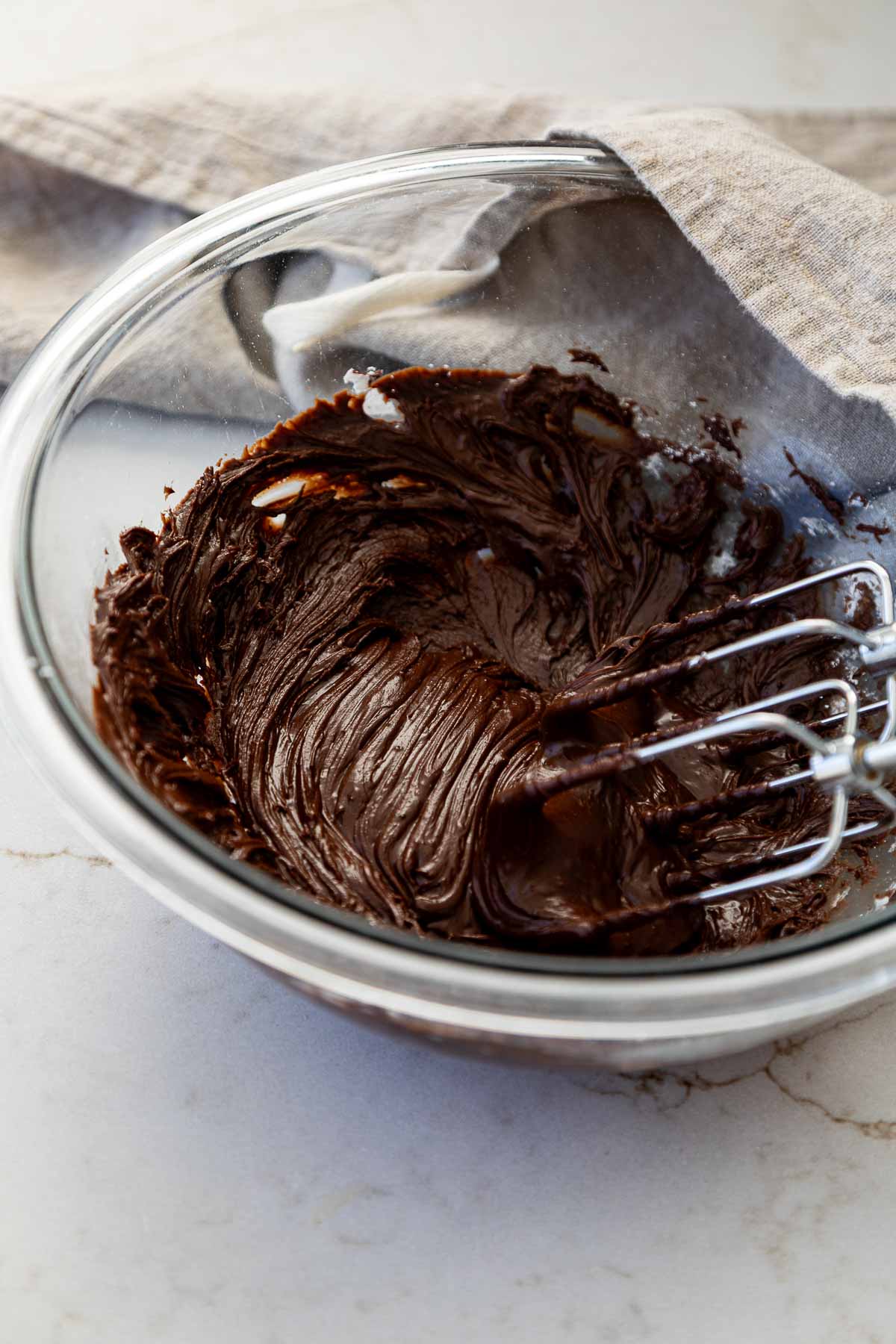 Chocolate Fudge Frosting in mixing bowl with beaters