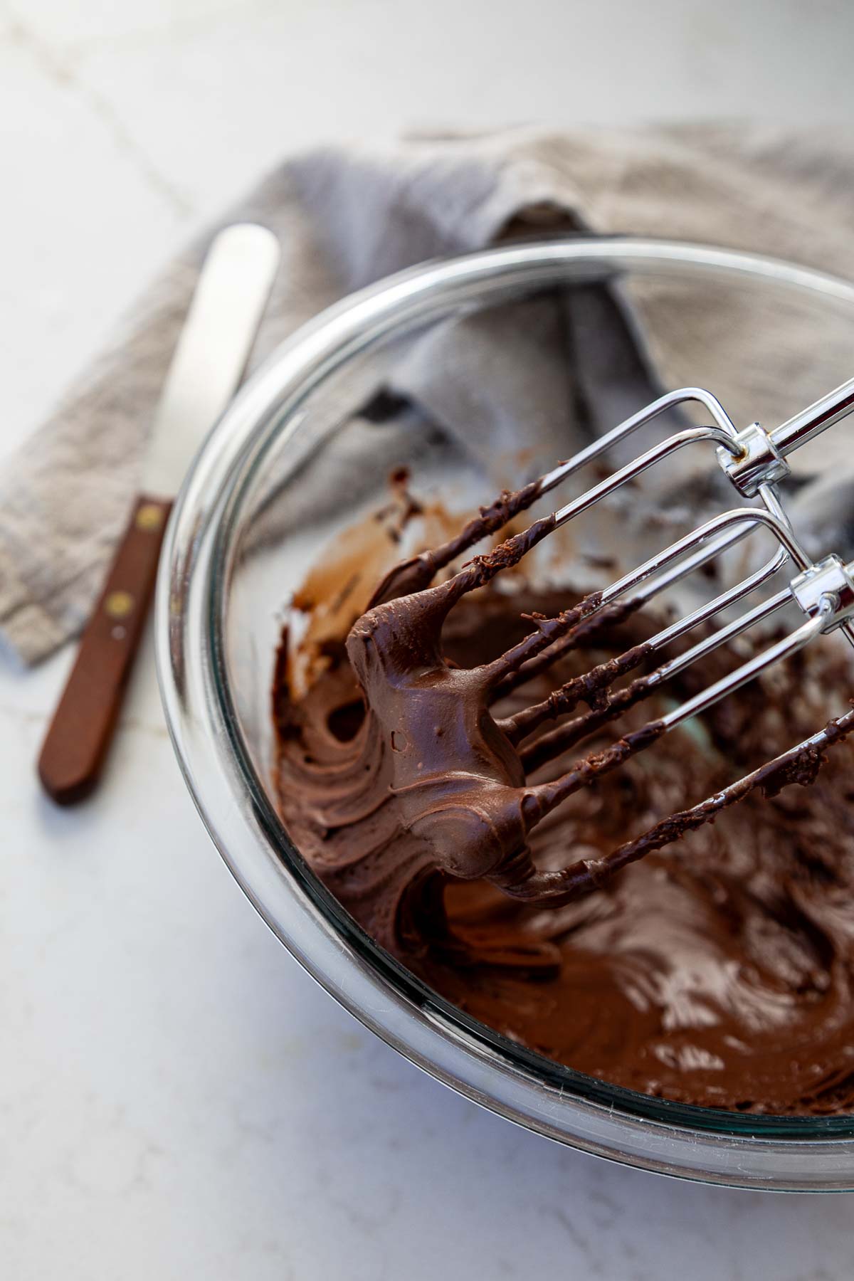 Chocolate Fudge Frosting in mixing bowl with beaters