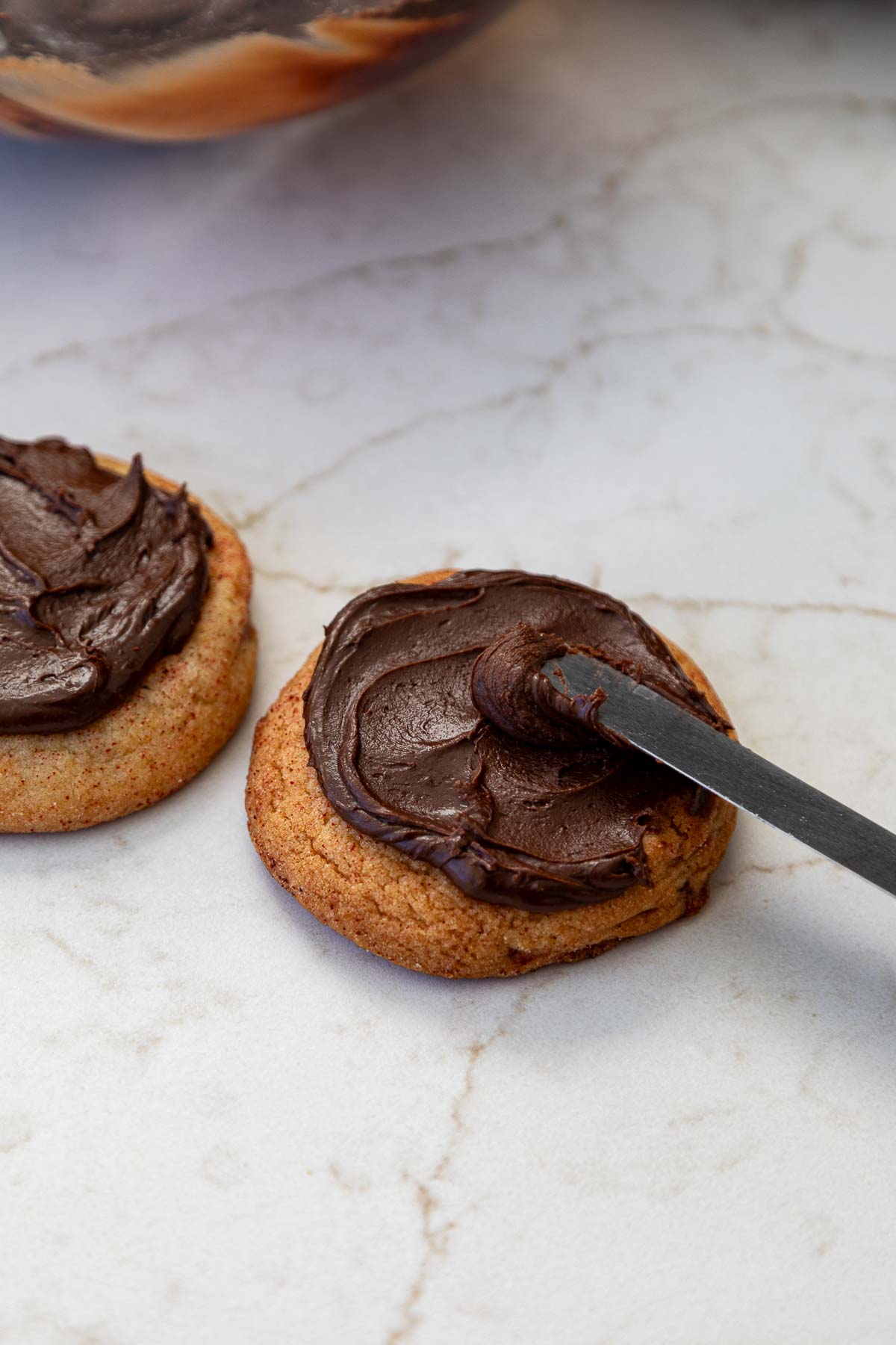 Chocolate Fudge Frosting on top of cookie