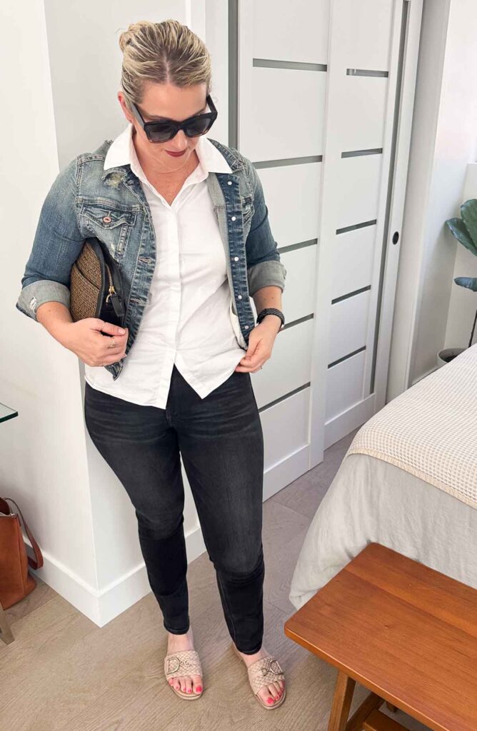 black jeans white shirt and denim jacket
