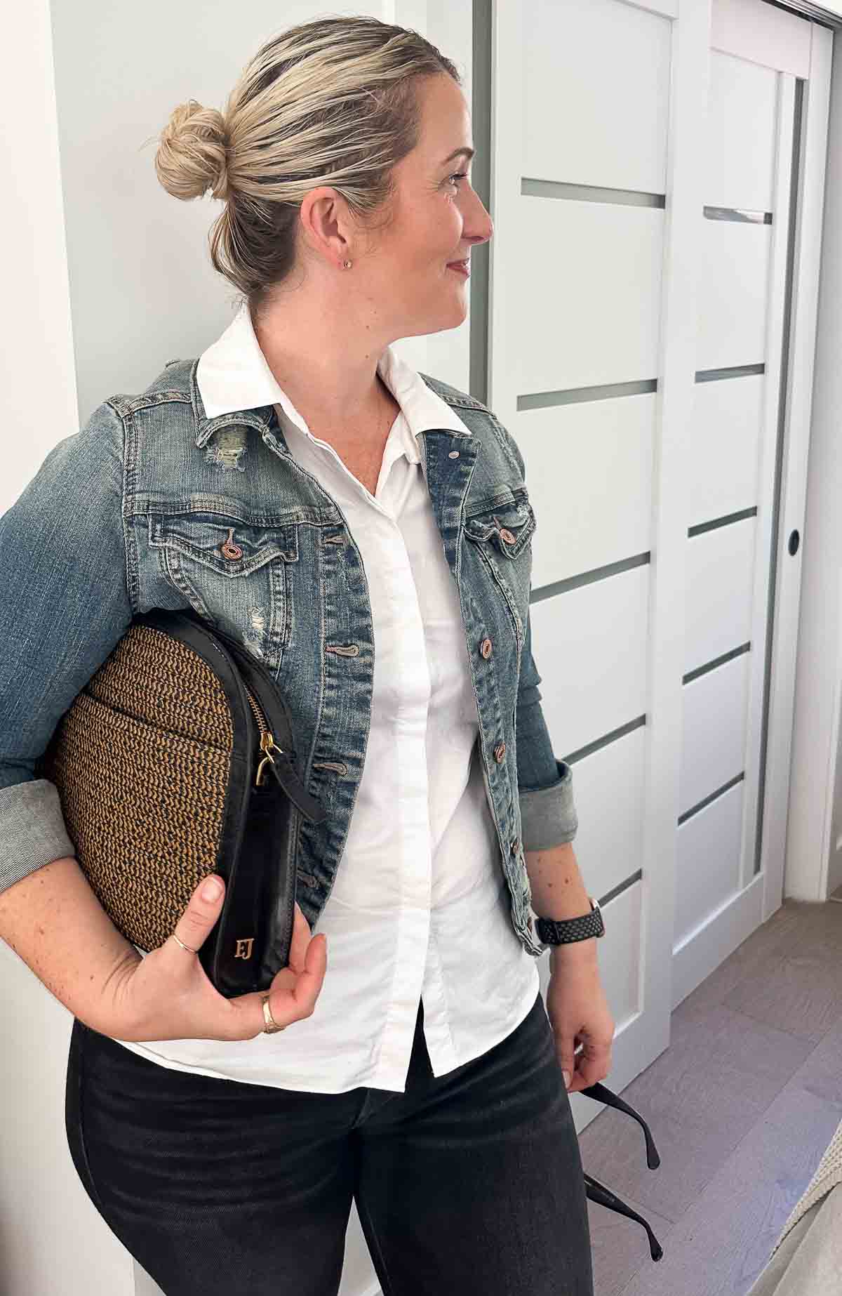 what to wear with a jean jacket - white button down and black jeans.