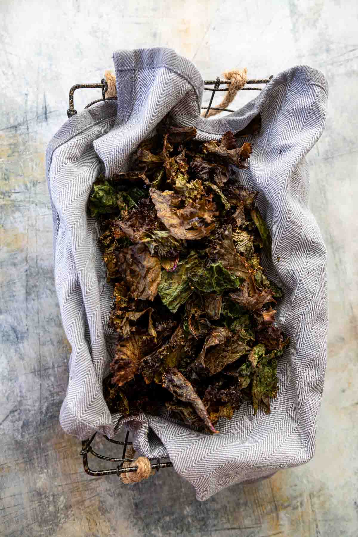 kale chips in towel lined basket