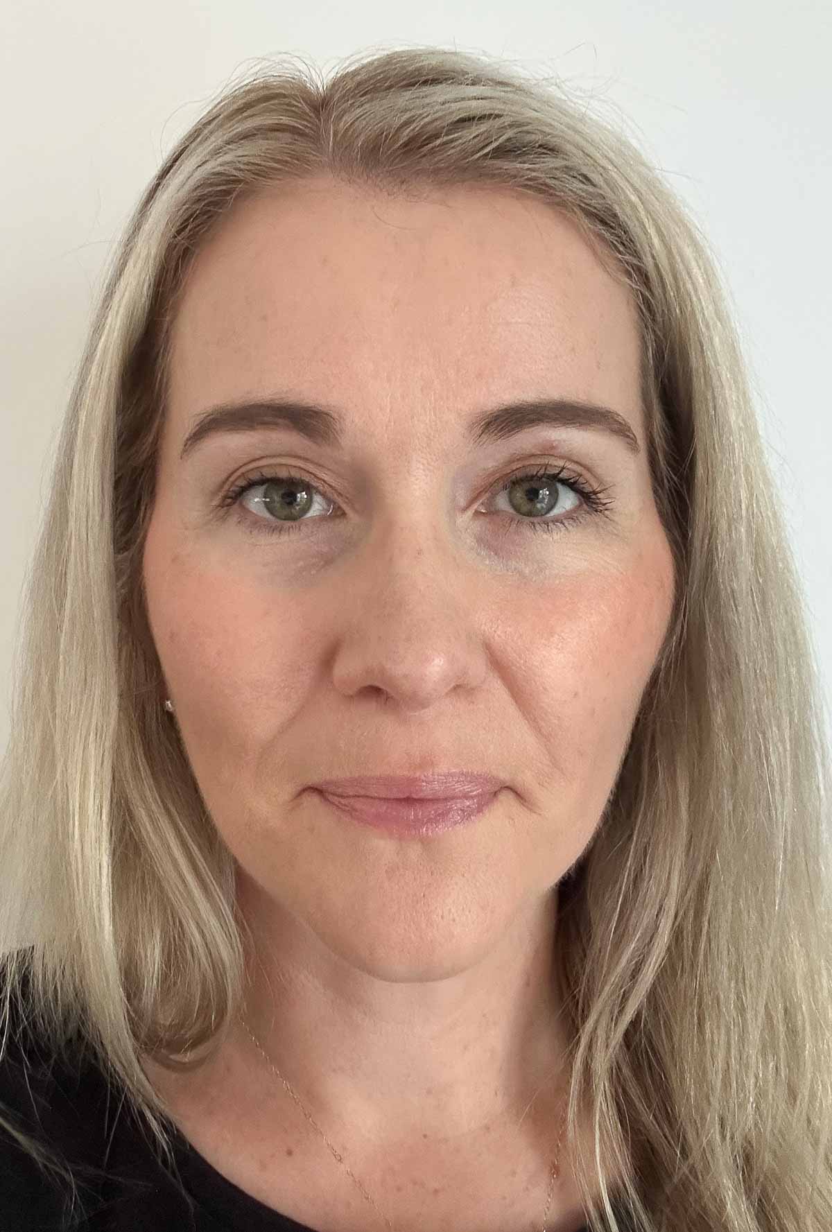 finished makeup look on woman facing camera. Best under eye concealer for mature skin 8