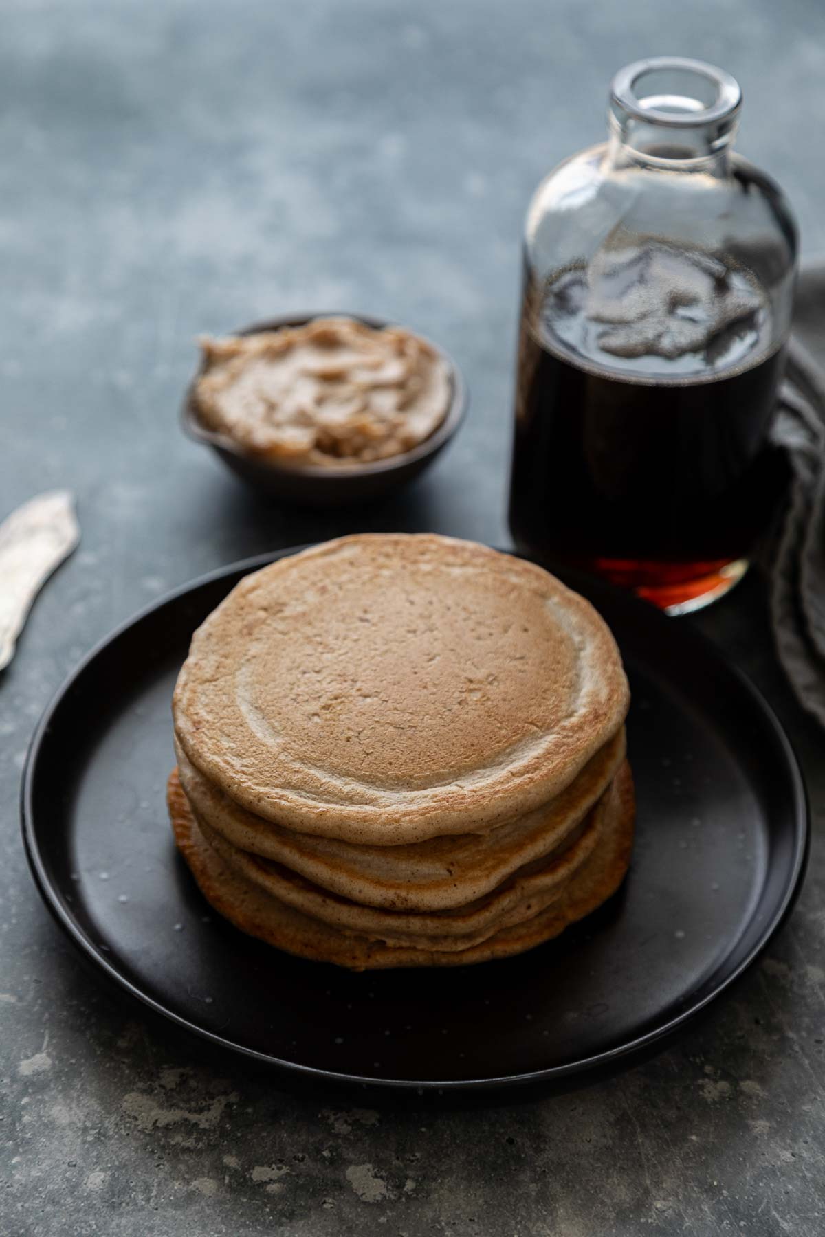Cinnamon Pancakes stacked on plate - no butter or syrup on top